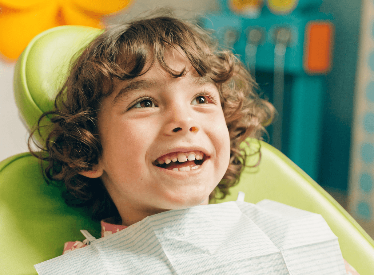 Child relaxed and smiling in dental chair at Tooth Time Dentistry Hartford CT